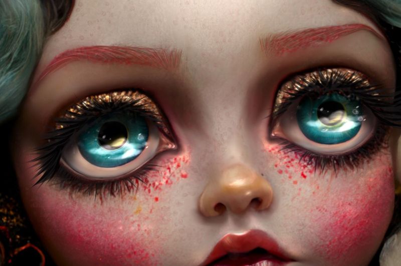 Close up detail of two glassy teal eyes with gold glitter lids and heavy lashes, pink glitter freckles scattered beneath them.