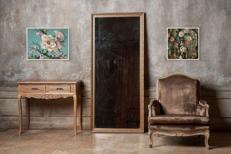 Two To Be So Afraid prints hung together on a plaster wall above a rustic desk between old wooden doors.