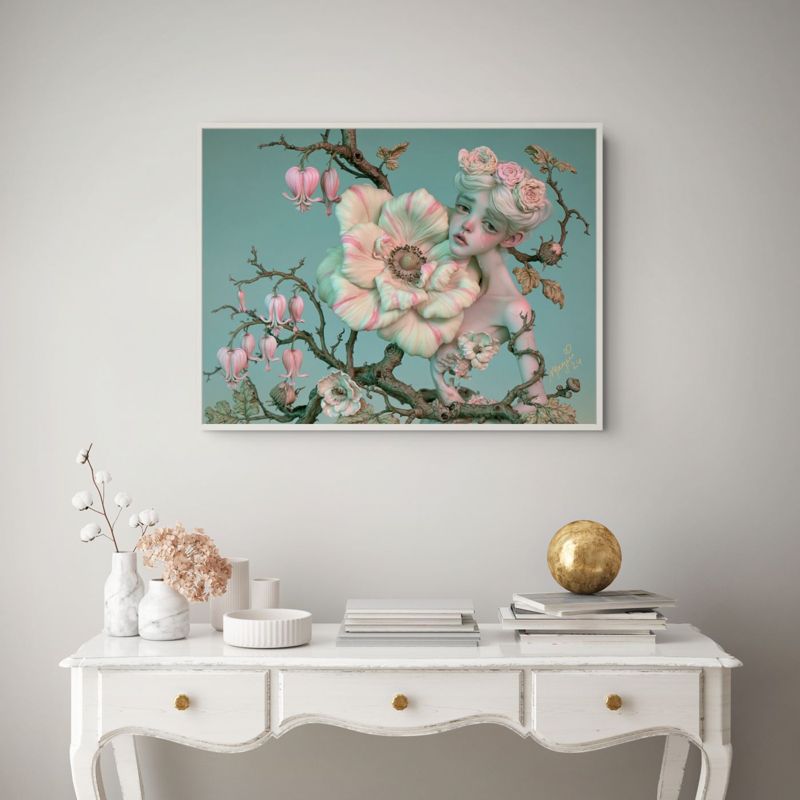 The flower doll on a branch print hung on a pale wall above a white French desk with a globe and vases.