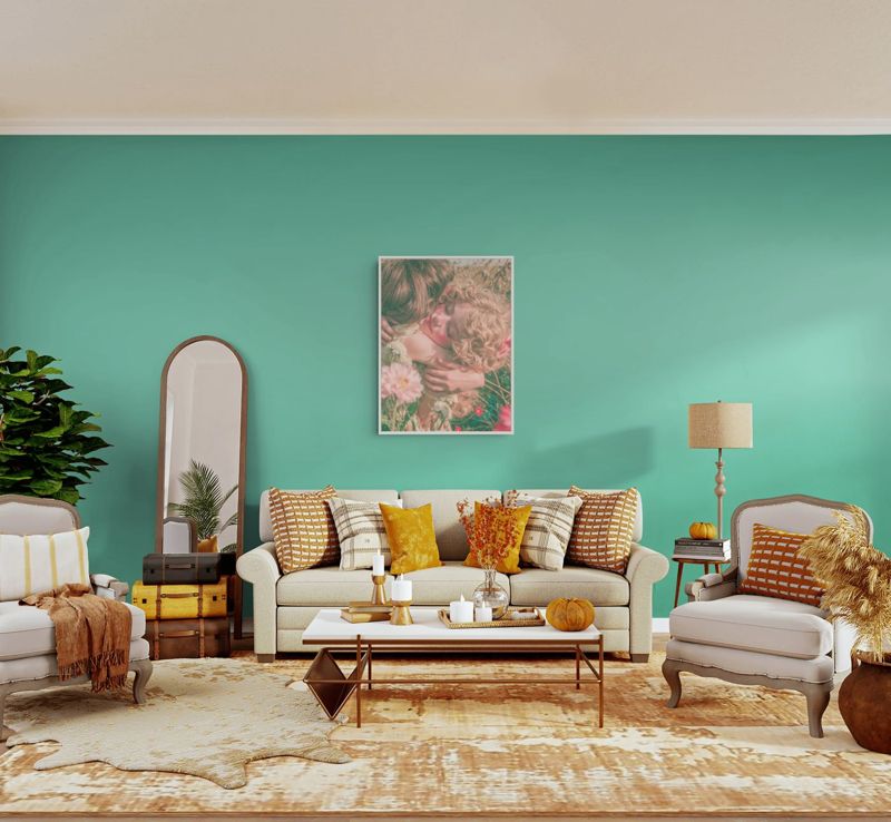 The friends in the flower field print hung on a mint wall above a white sofa with cushions and a gold coffee table.